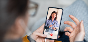 Woman doing video call with doctor